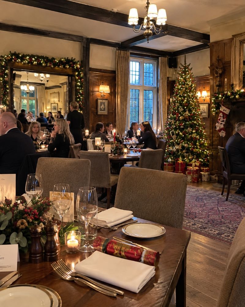Christmas Day table setting with candles and a decorated tree