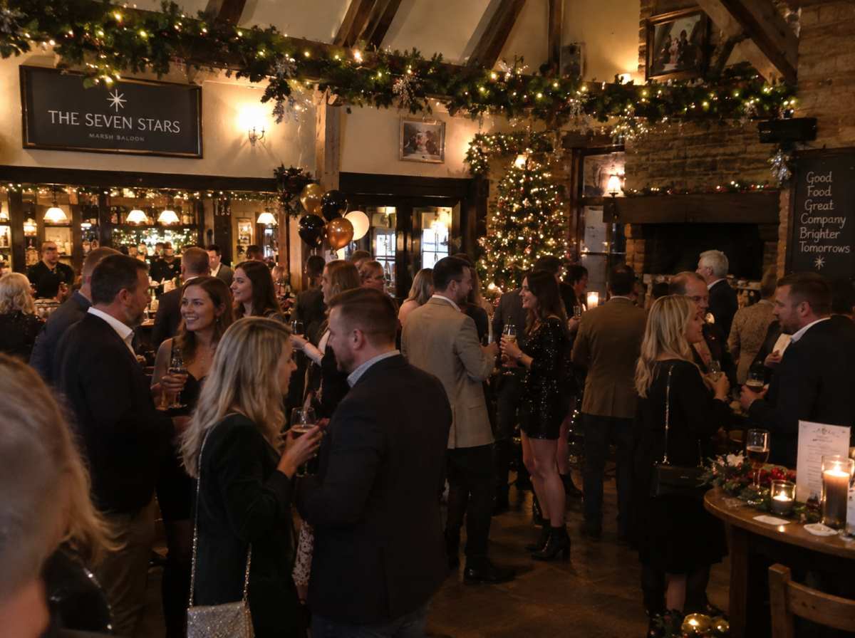 A Christmas party underway at a candlelit country pub