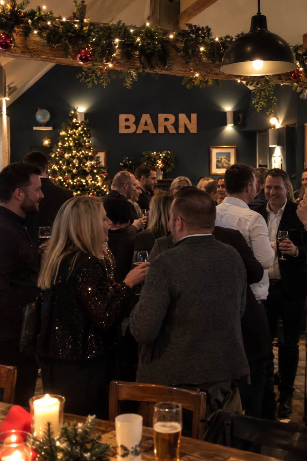 Friends raising a toast at a Christmas party in the pub